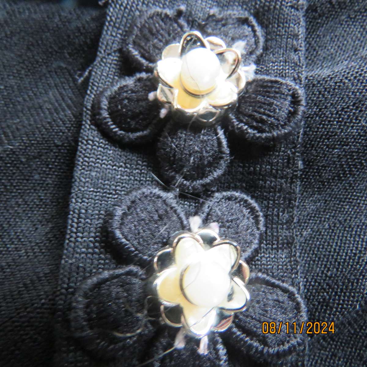 Gorgeous black day/evening wear top. One sleeve partly lace.Other naked shoulder. Size 36.As new