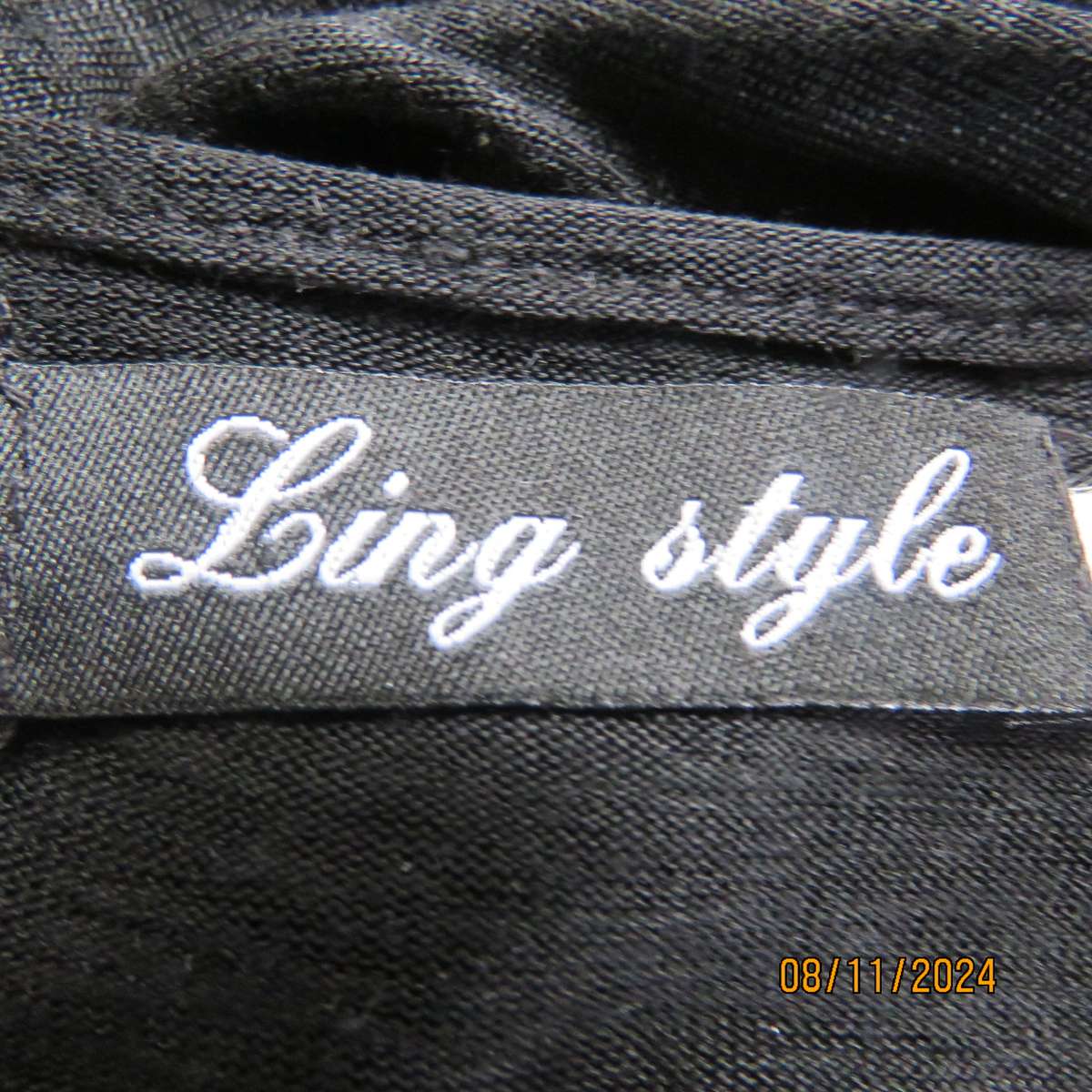 Gorgeous black day/evening wear top. One sleeve partly lace.Other naked shoulder. Size 36.As new