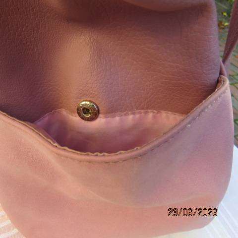 Pink PVC sling bag with side bags and front zipped compartments polyester lining