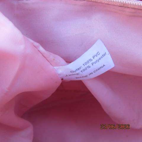 Pink PVC sling bag with side bags and front zipped compartments polyester lining