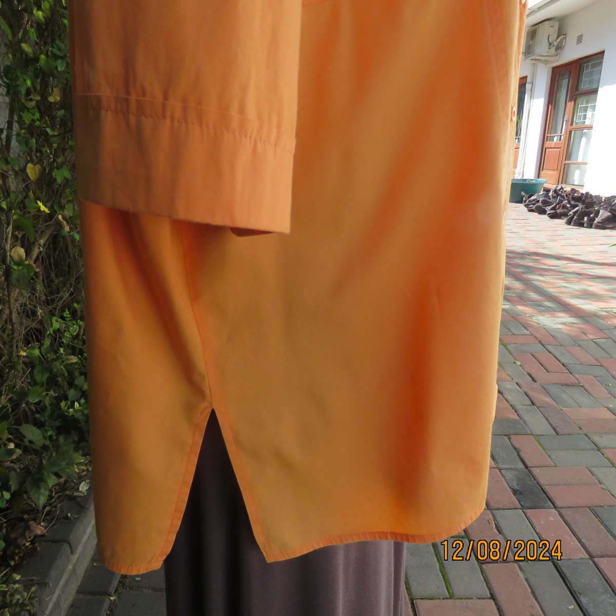 Easy to wear papaya colour button down top with gathered empire front. Size 50by DONATELLA. As new