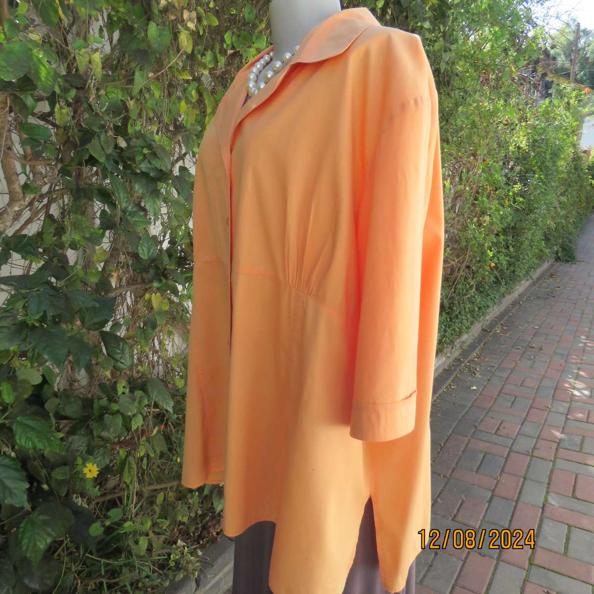 Easy to wear papaya colour button down top with gathered empire front. Size 50by DONATELLA. As new