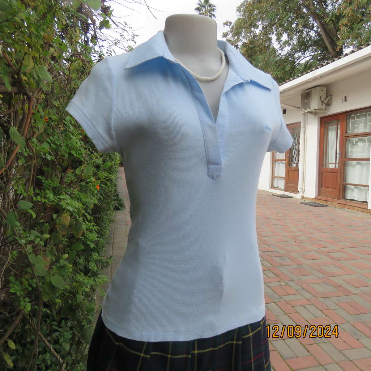 High quality baby blue capped sleeve ribbed cotton stretch JEEP top. Open cotton collar. Size 34.