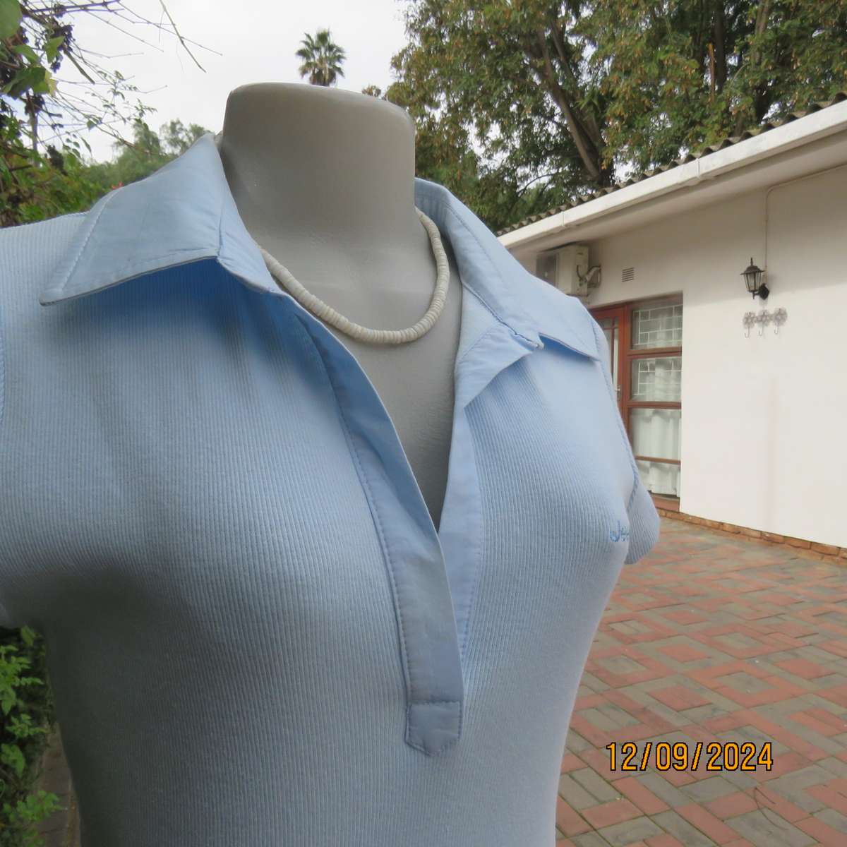 High quality baby blue capped sleeve ribbed cotton stretch JEEP top. Open cotton collar. Size 34.