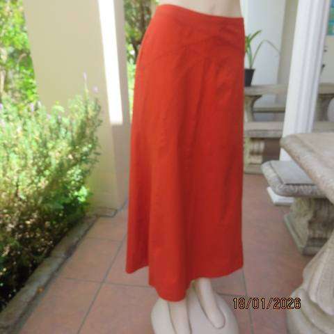 Burnt orange uniquely paneled A-line ankle skirt in 100% cotton. Size 38