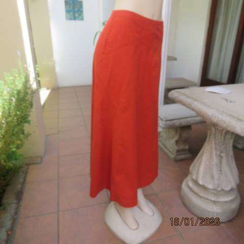 Burnt orange uniquely paneled A-line ankle skirt in 100% cotton. Size 38