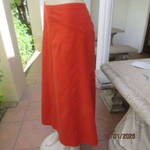 Burnt orange uniquely paneled A-line ankle skirt in 100% cotton. Size 38