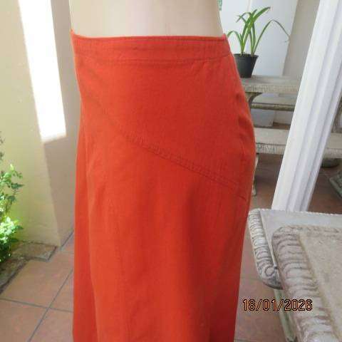 Burnt orange uniquely paneled A-line ankle skirt in 100% cotton. Size 38