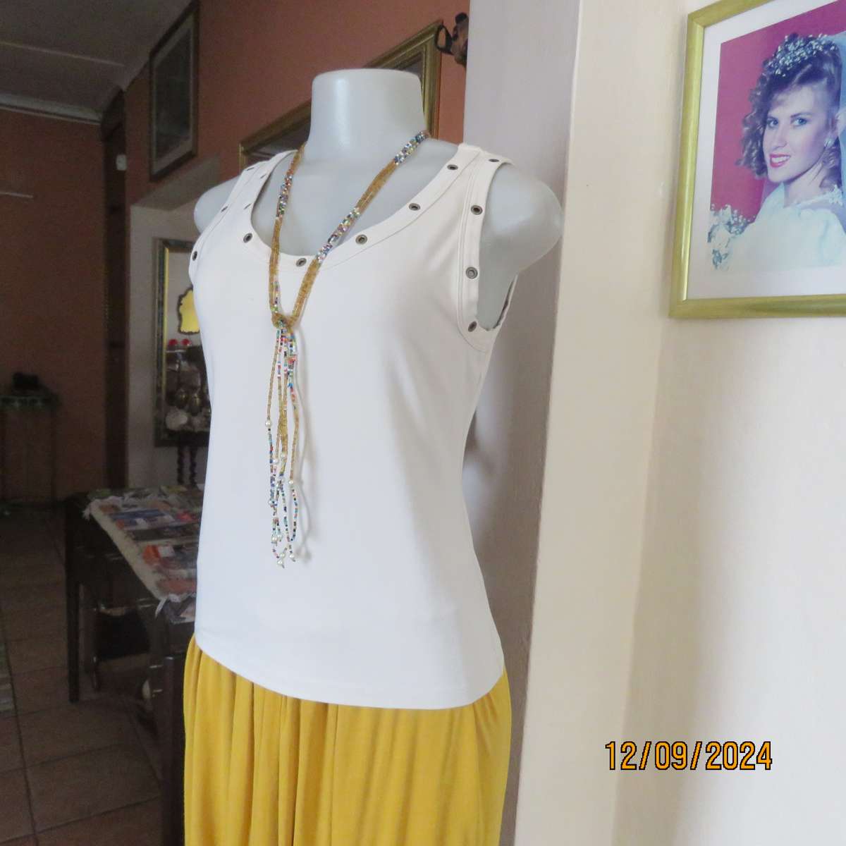 Top of the line sleeveless brass stud decorated top in light fawn. By WOOLWORTHS size 36. New cond.