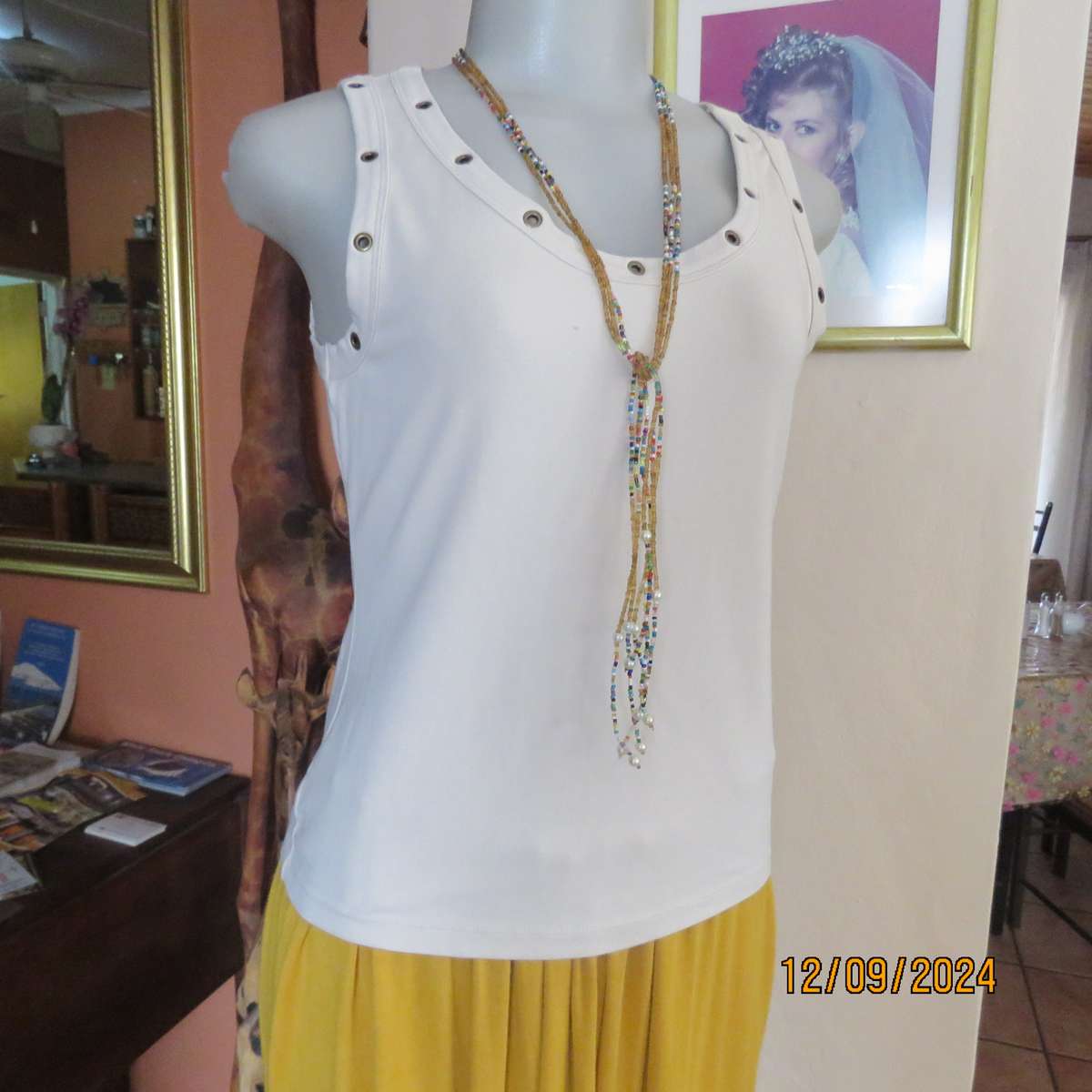 Top of the line sleeveless brass stud decorated top in light fawn. By WOOLWORTHS size 36. New cond.