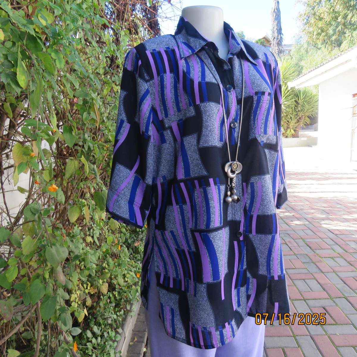 Geometric print button down top in black-lilac-blue and grey. Open collar. Size 40