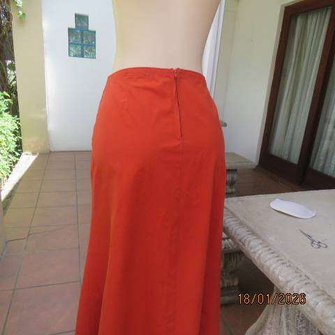 Burnt orange uniquely paneled A-line ankle skirt in 100% cotton. Size 38