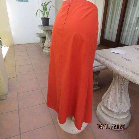 Burnt orange uniquely paneled A-line ankle skirt in 100% cotton. Size 38