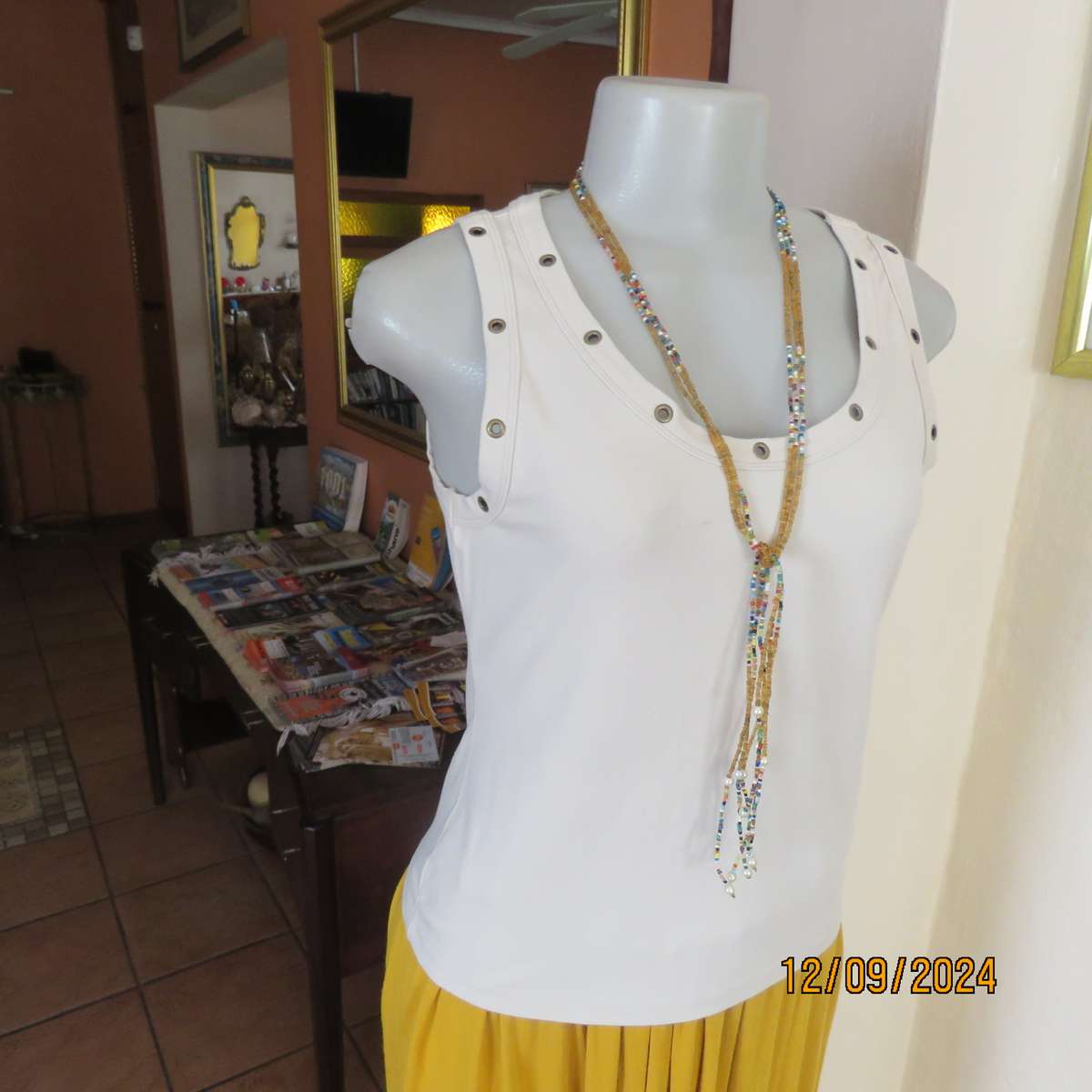 Top of the line sleeveless brass stud decorated top in light fawn. By WOOLWORTHS size 36. New cond.