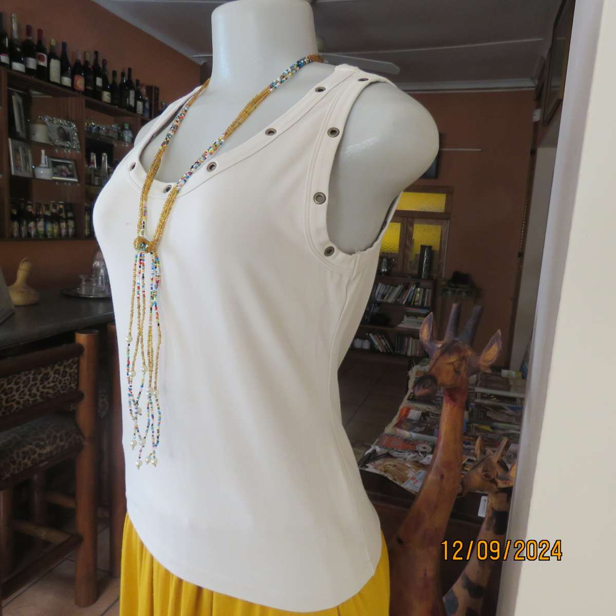 Top of the line sleeveless brass stud decorated top in light fawn. By WOOLWORTHS size 36. New cond.