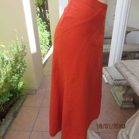 Burnt orange uniquely paneled A-line ankle skirt in 100% cotton. Size 38