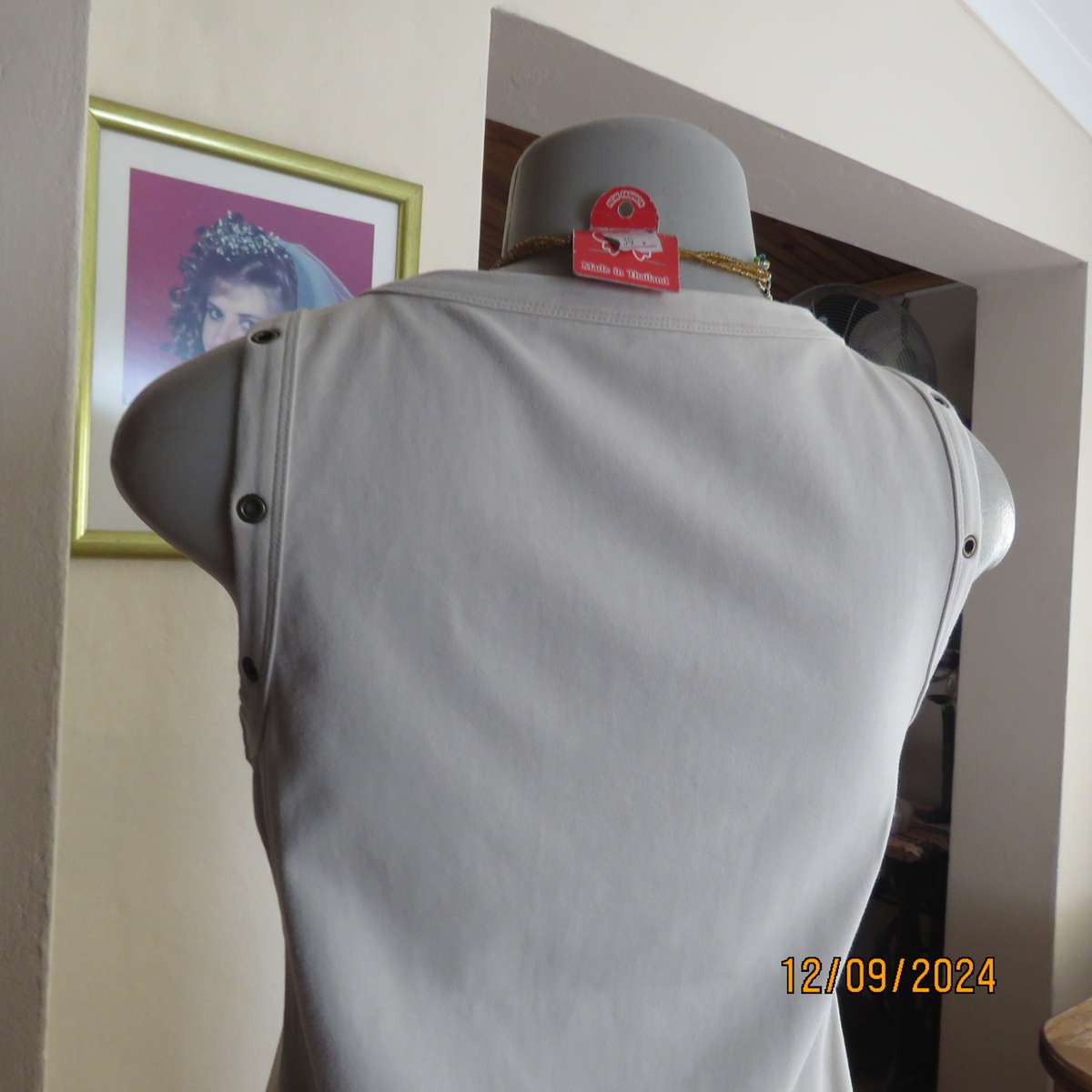 Top of the line sleeveless brass stud decorated top in light fawn. By WOOLWORTHS size 36. New cond.