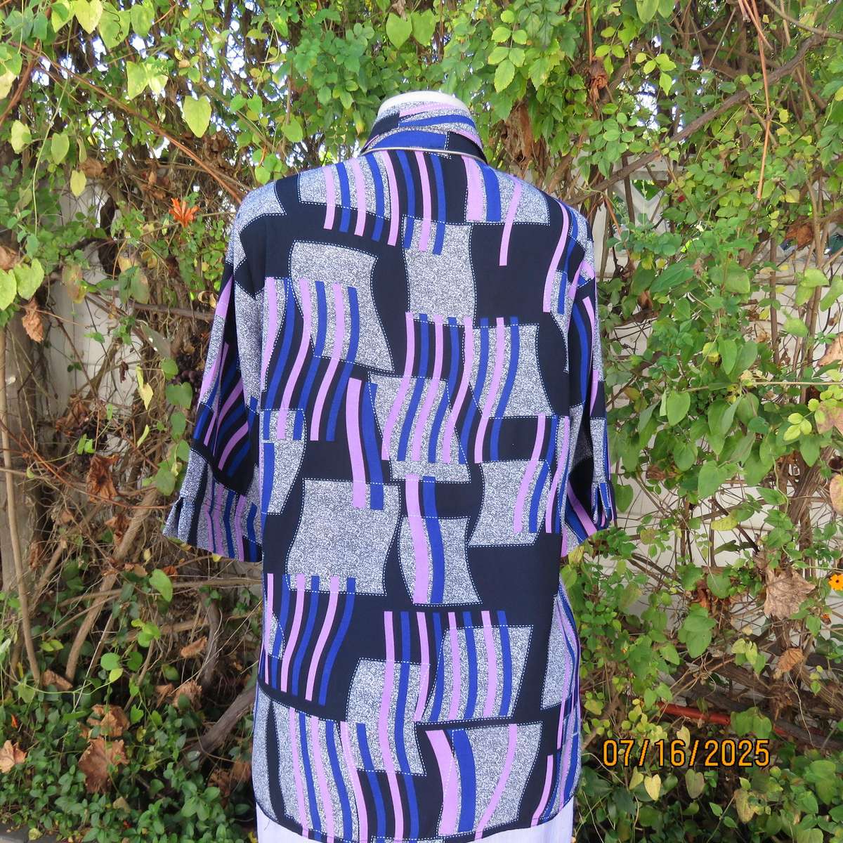 Geometric print button down top in black-lilac-blue and grey. Open collar. Size 40