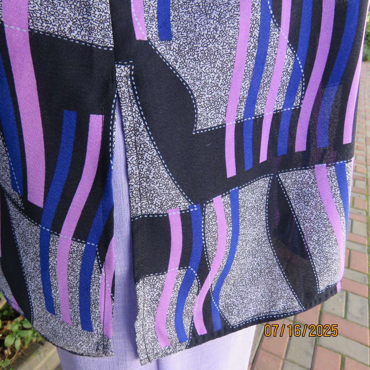 Geometric print button down top in black-lilac-blue and grey. Open collar. Size 40