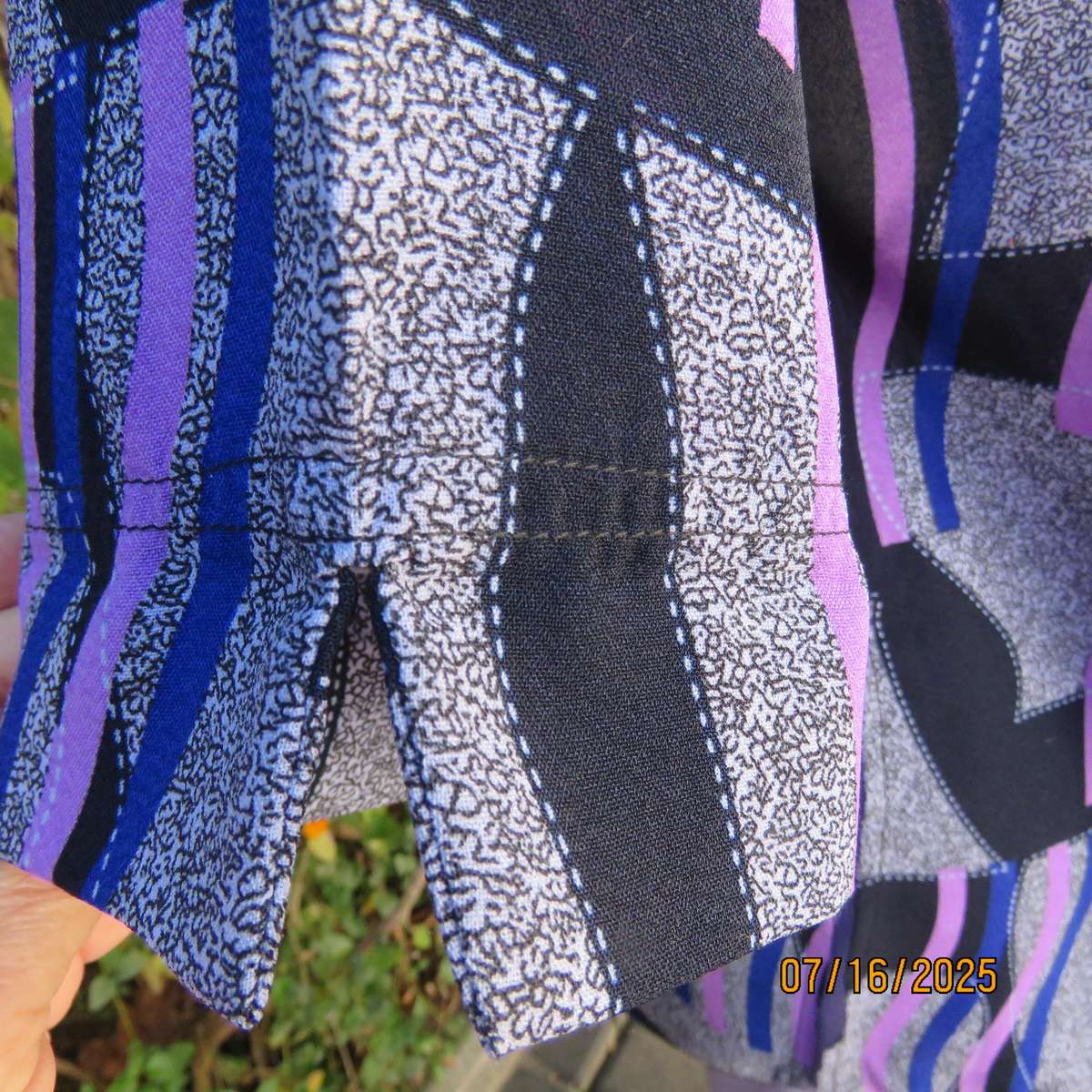 Geometric print button down top in black-lilac-blue and grey. Open collar. Size 40