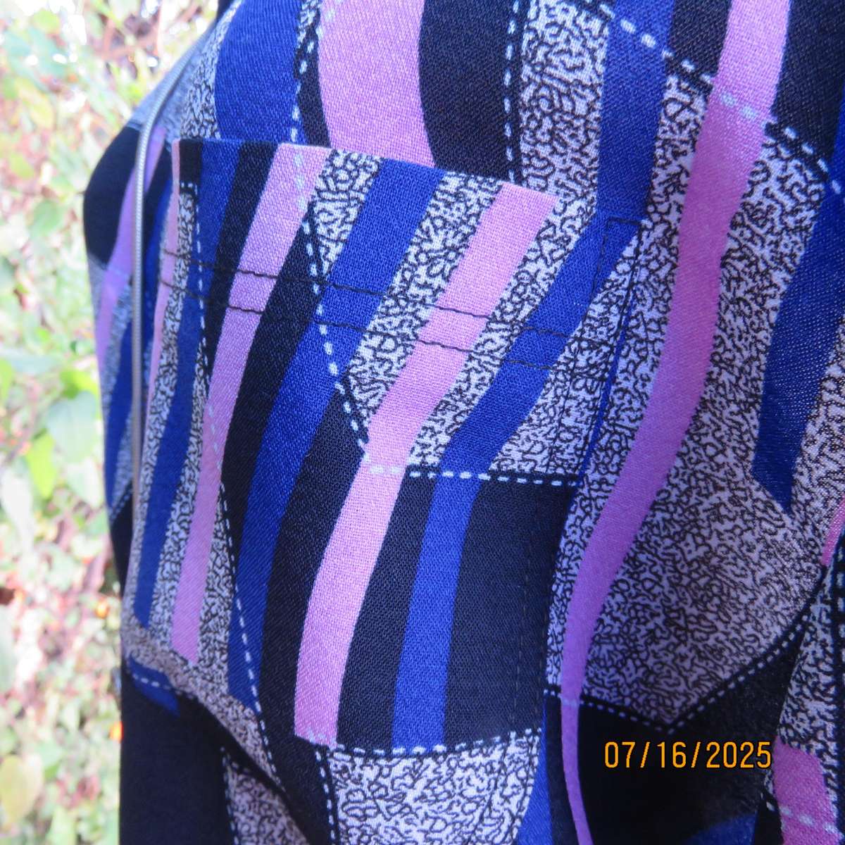 Geometric print button down top in black-lilac-blue and grey. Open collar. Size 40