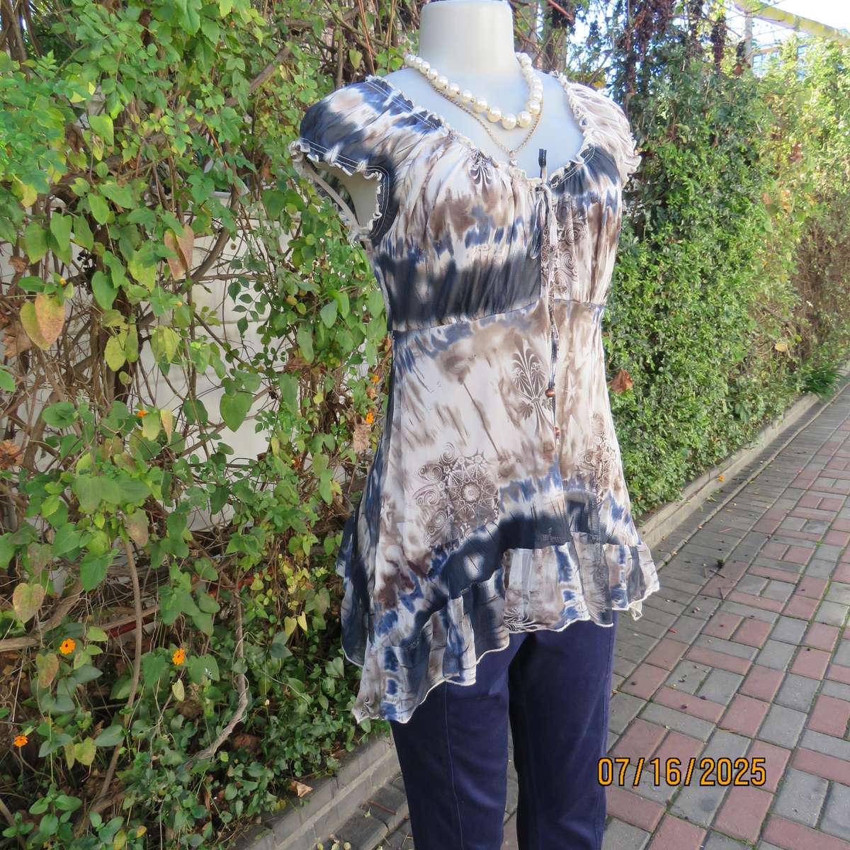 NEWS high-low empire style lined sheer polyester top in blue-cream and brown print. Size 34