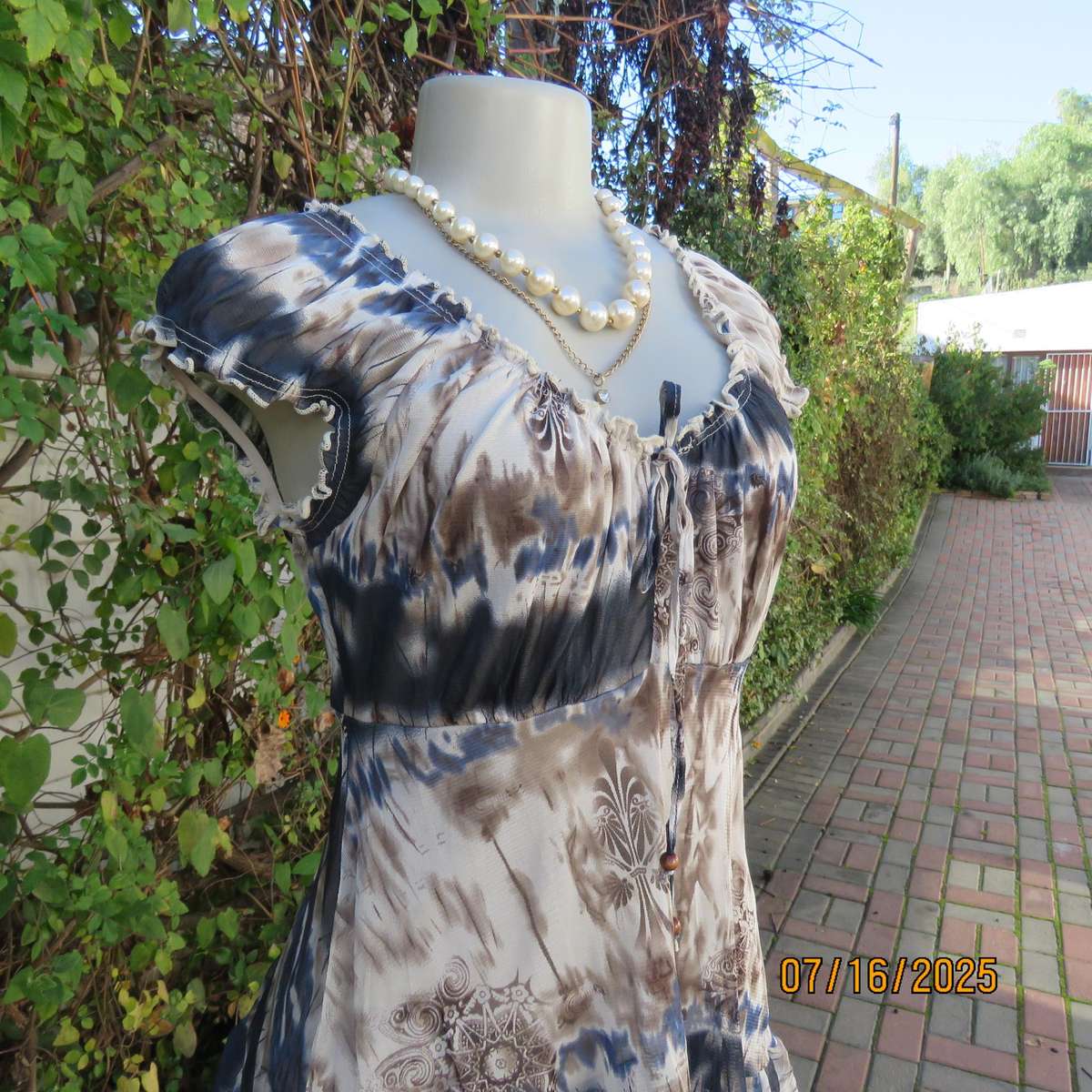 NEWS high-low empire style lined sheer polyester top in blue-cream and brown print. Size 34