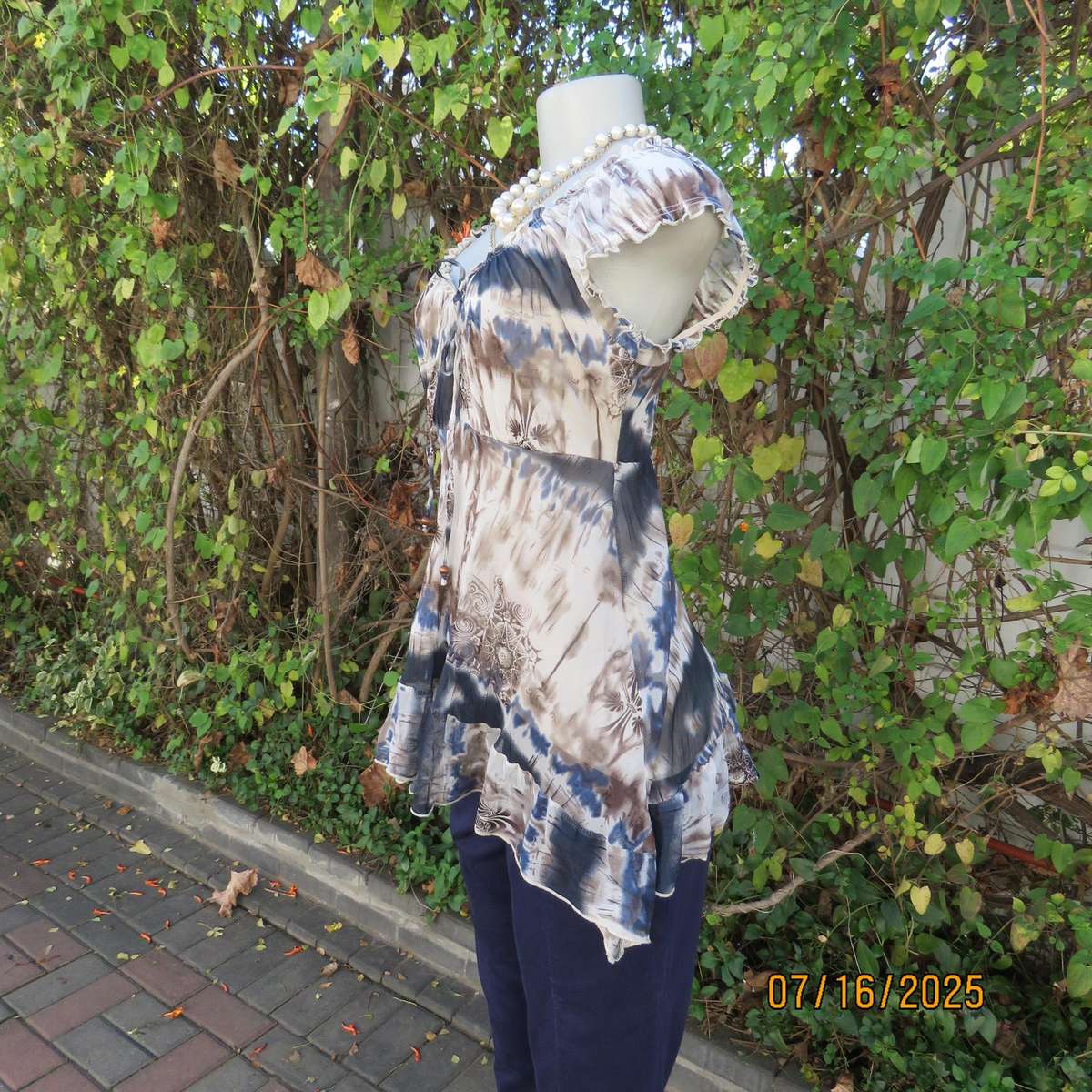 NEWS high-low empire style lined sheer polyester top in blue-cream and brown print. Size 34