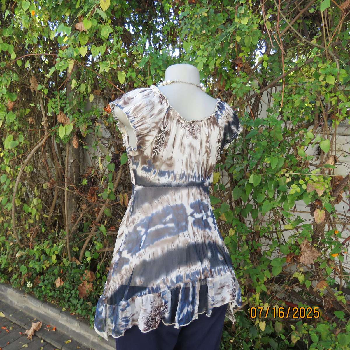 NEWS high-low empire style lined sheer polyester top in blue-cream and brown print. Size 34