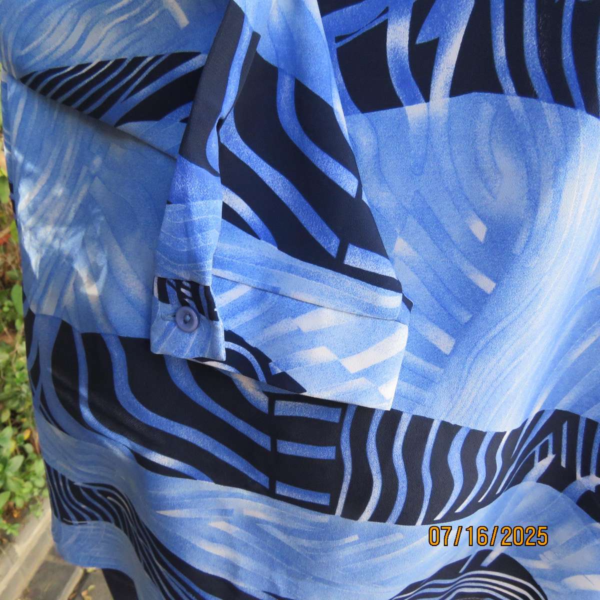 DELSWA long sleeve button down top in shades of blue with animal print. Size 44