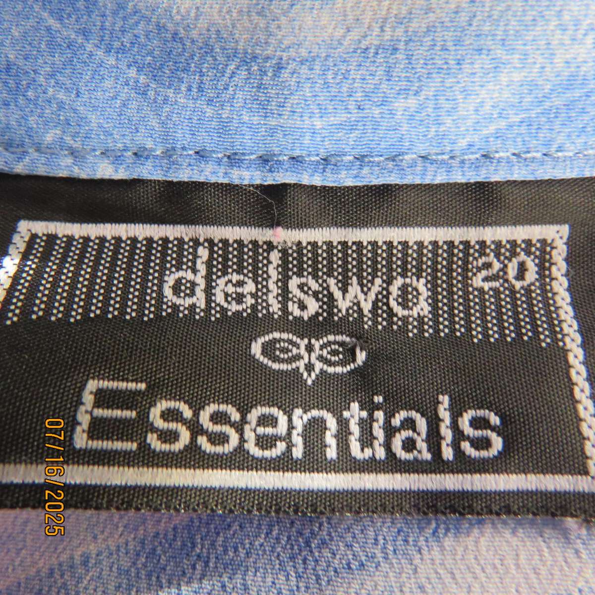 DELSWA long sleeve button down top in shades of blue with animal print. Size 44