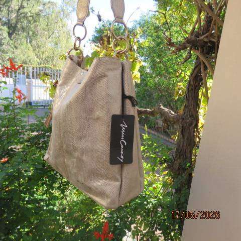Miss Cassidy gold shoulder bag with gold buckle decoration and vertical front zip