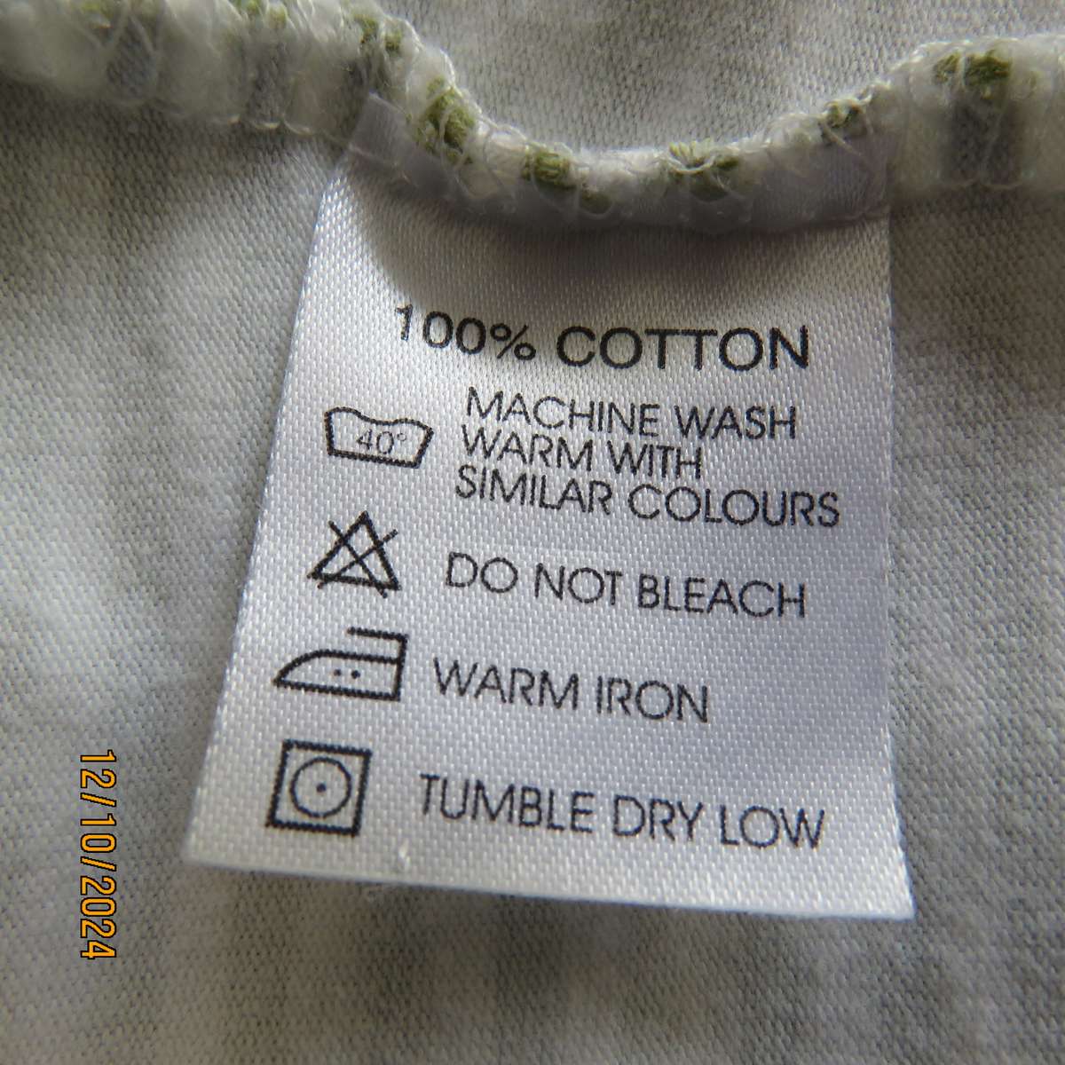 Chic olive green/white horizontal striped cotton top by INDIGO from Canada.Size 34/36. Pink edging.