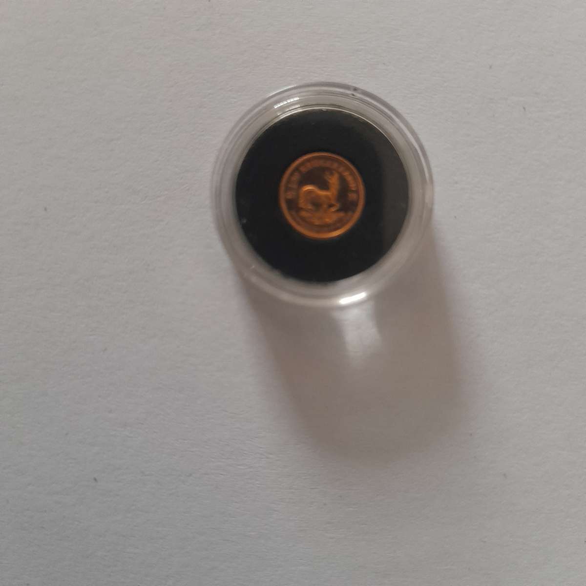 The 2018 South African 1 Rand 1/50oz Solid Gold Krugerrand coin in a capsule