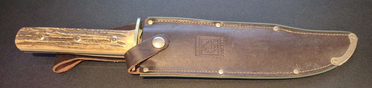 Original handmade German Solingen Inox Linder Bowie knife with etched Western/hunting scene.