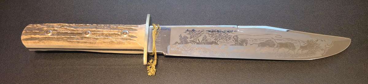 Original handmade German Solingen Inox Linder Bowie knife with etched Western/hunting scene.