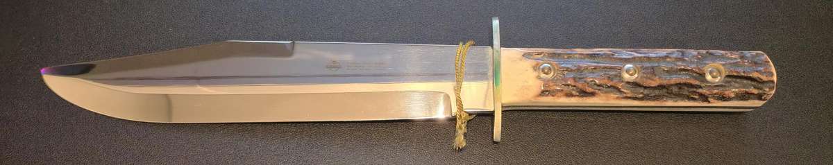 Original handmade German Solingen Inox Linder Bowie knife with etched Western/hunting scene.