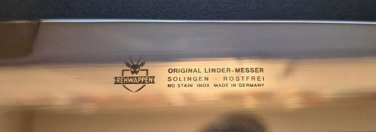 Original handmade German Solingen Inox Linder Bowie knife with etched Western/hunting scene.