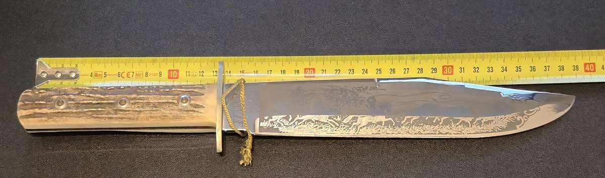 Original handmade German Solingen Inox Linder Bowie knife with etched Western/hunting scene.