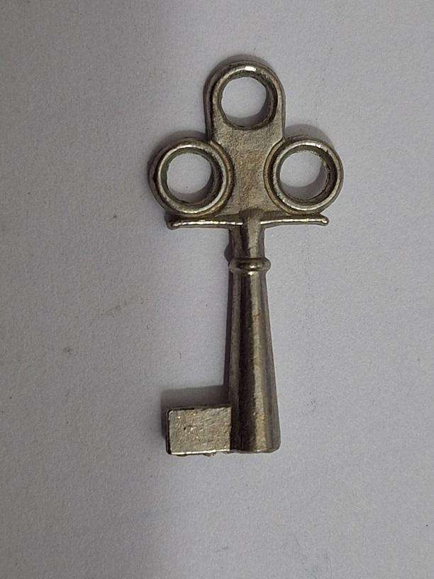 Small key, possibly for small clock or music box