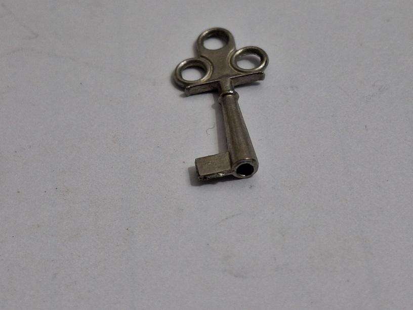 Small key, possibly for small clock or music box