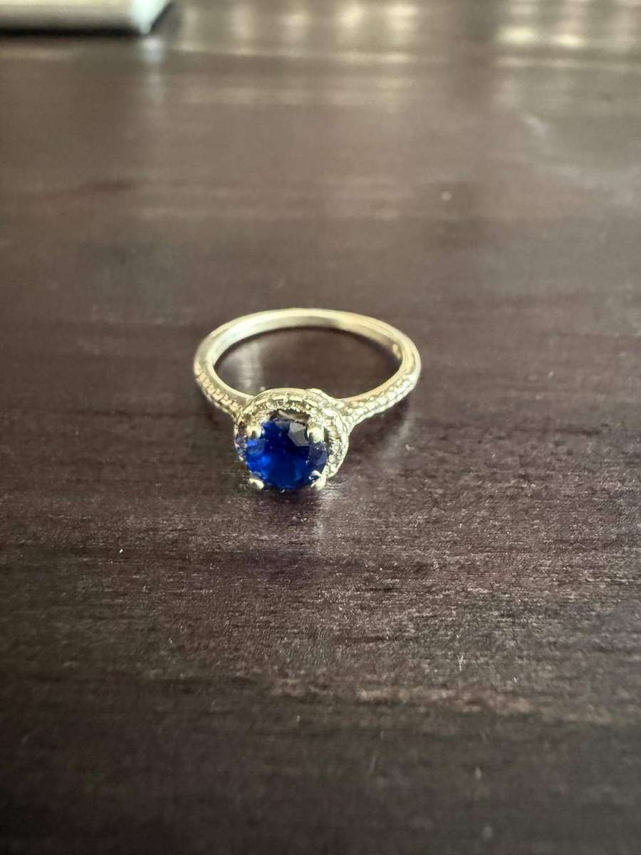 Sterling silver tiny blue stone ring