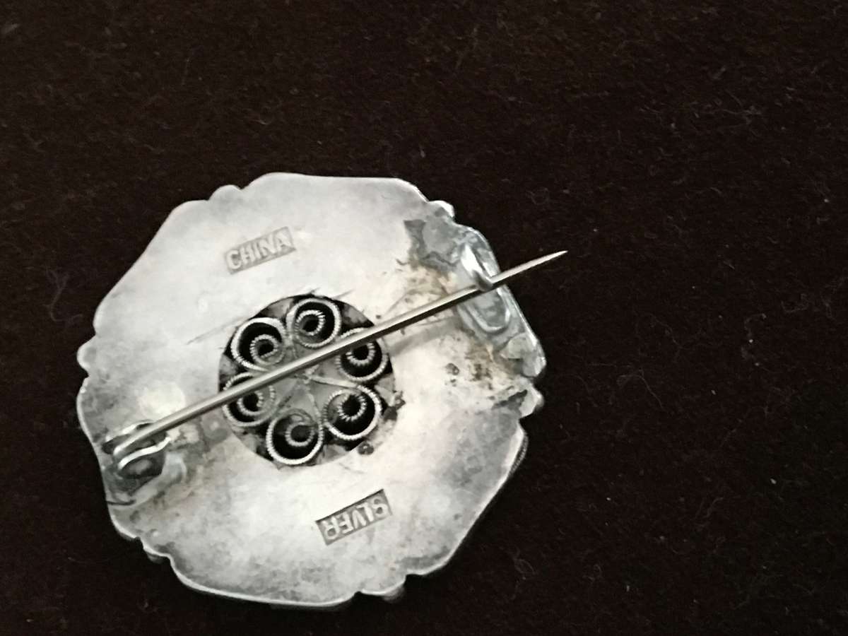 A Chinese Silver Filigree Brooch with Turquoise and Coral Cabochons