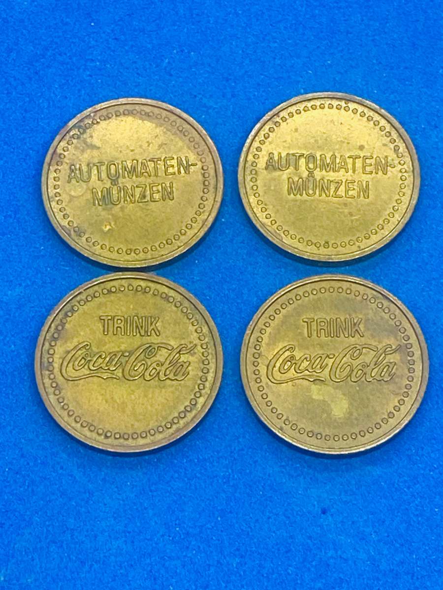 FOUR OLD GERMAN COCA COLA VENDING MACHINE TOKENS