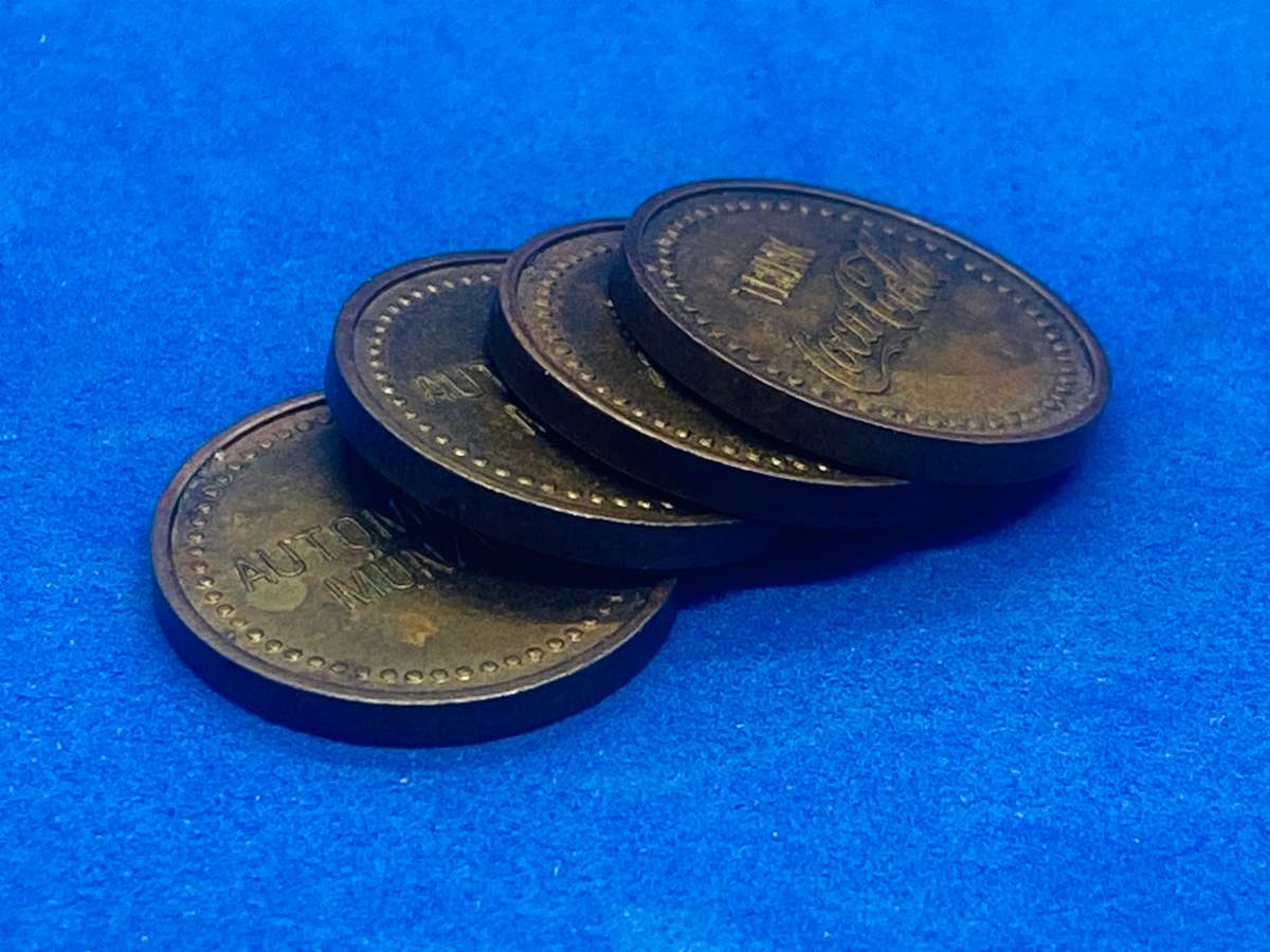 FOUR OLD GERMAN COCA COLA VENDING MACHINE TOKENS