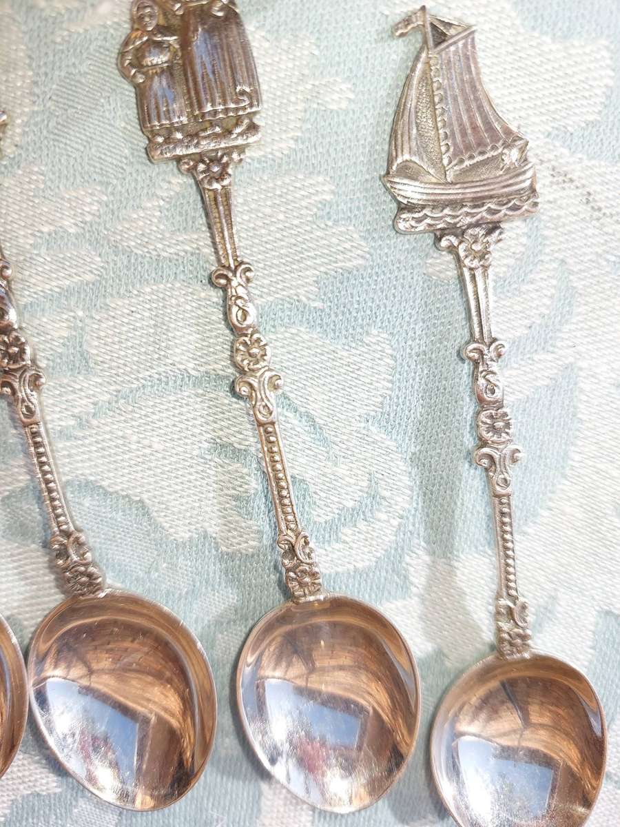 A SET OF DELF TYPE DUTCH COLLECTORS TEASPOONS EPNS SOLD AS IS