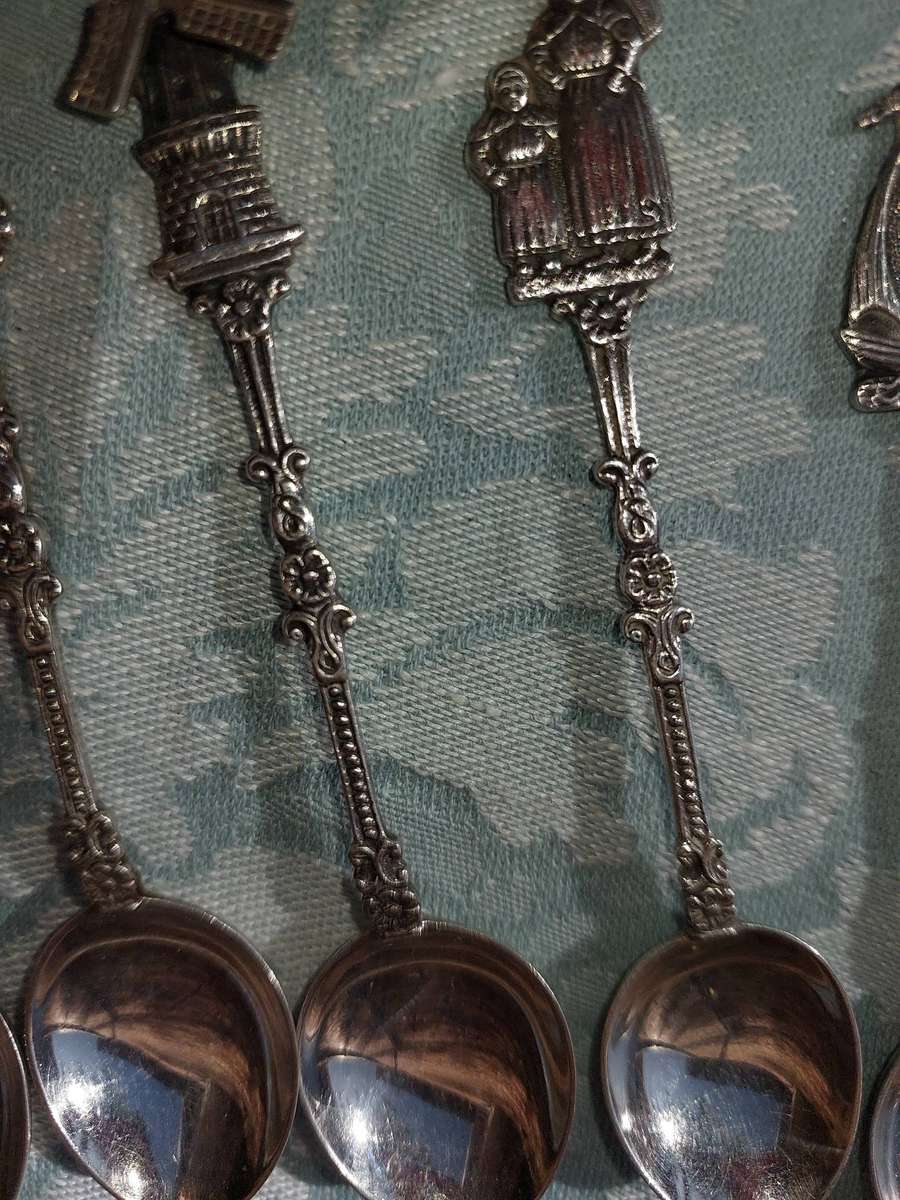 A SET OF DELF TYPE DUTCH COLLECTORS TEASPOONS EPNS SOLD AS IS