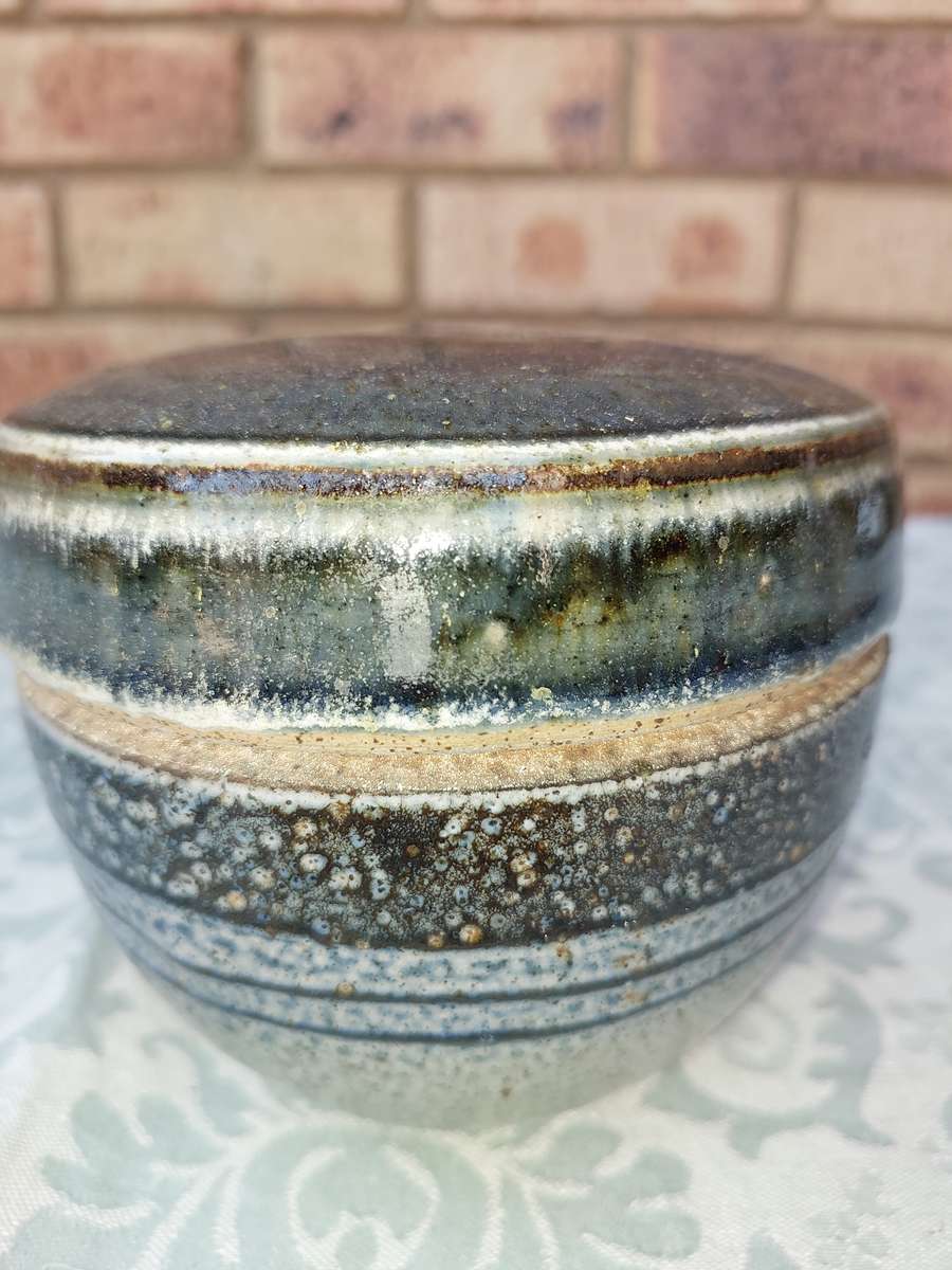 A CERAMIC BAKED GINGER JAR