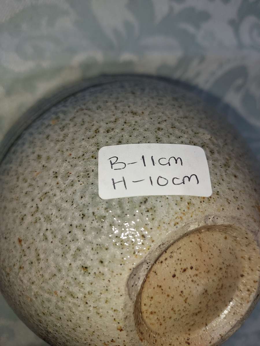 A CERAMIC BAKED GINGER JAR