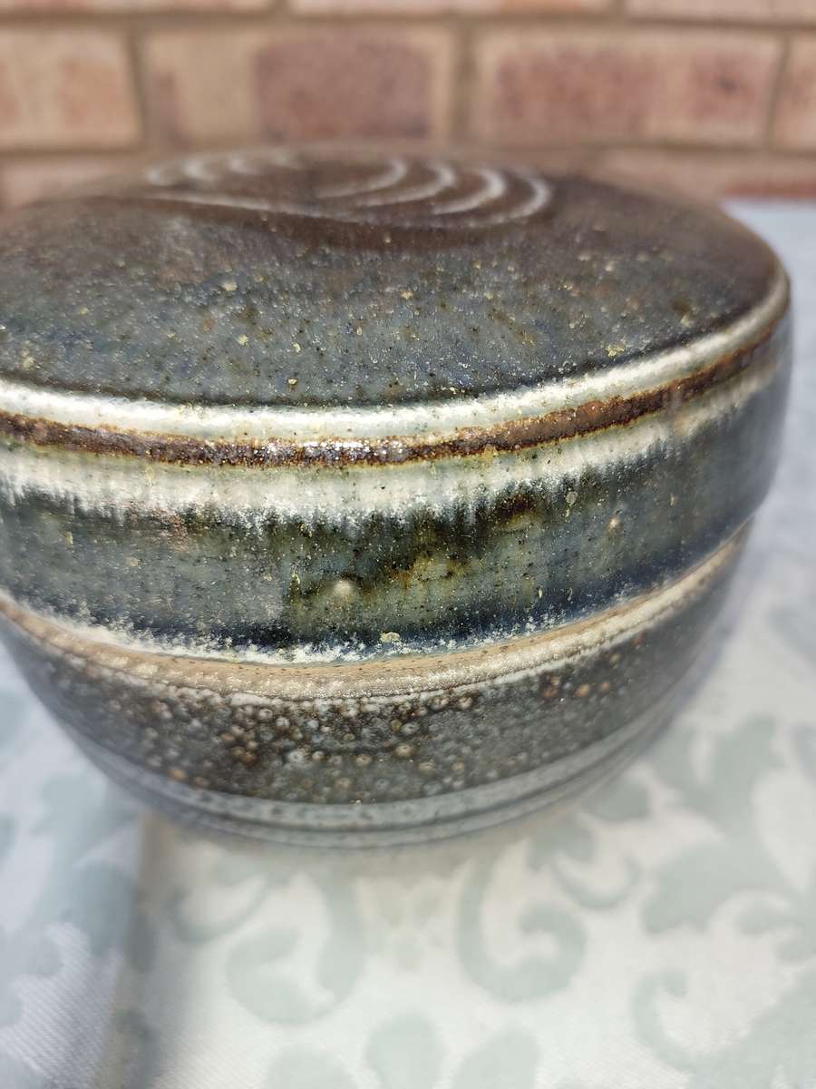 A CERAMIC BAKED GINGER JAR